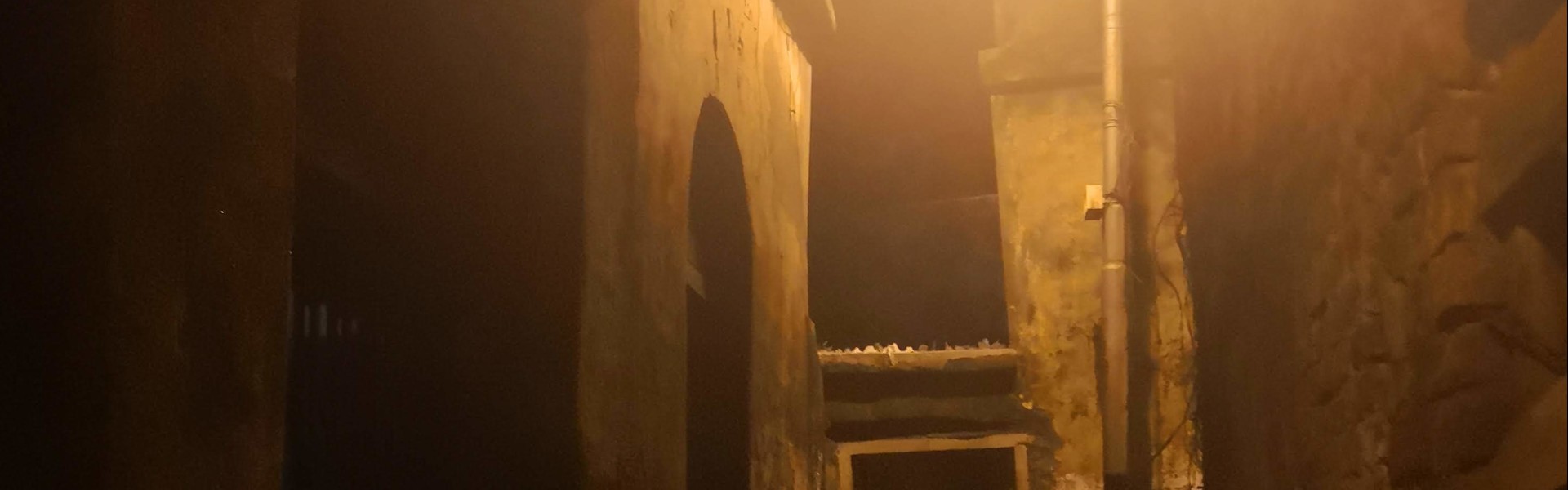 Narrow alley with dim light